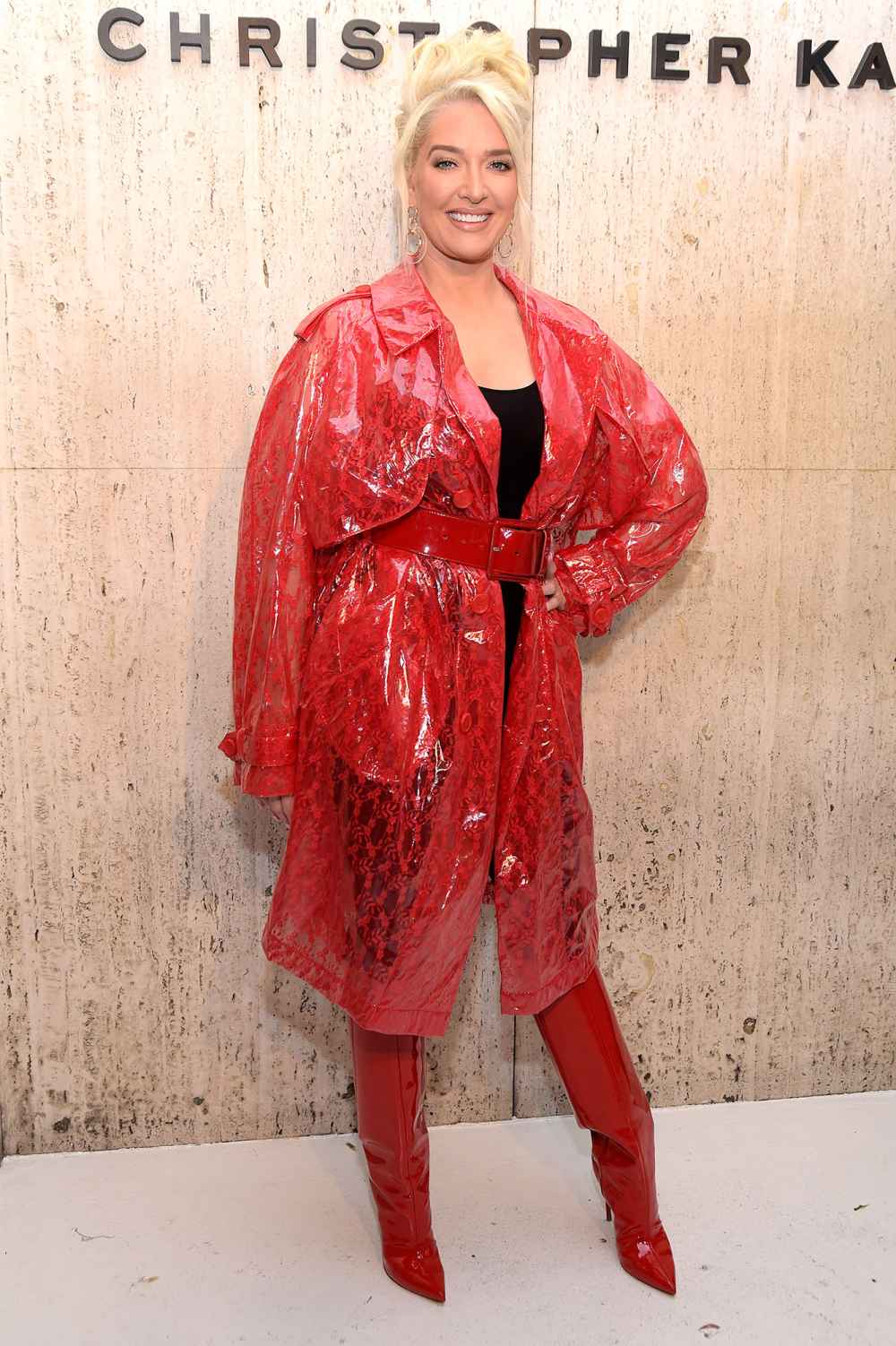 Erika Jayne Attends Christopher Kane's Party At Giorgio's Wearing A Long Red Jacket or Coat and Red Boots
