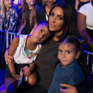 Kim Kardashian cuddles daughter North West and niece Penelope Disick