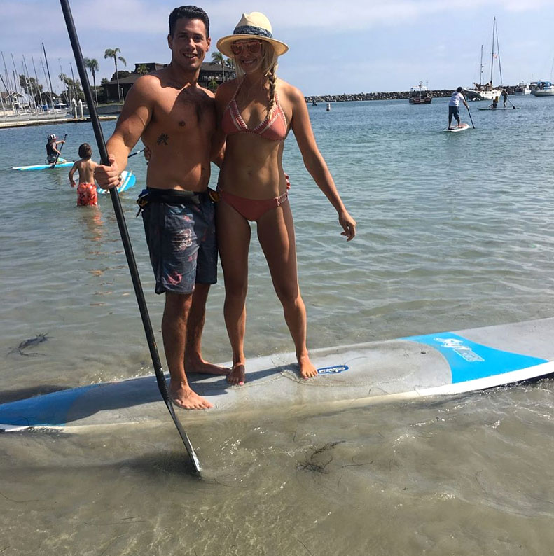 Gina Kirschenheiter and Matthew Kirschenheiter On A Water Board In Bathing Suit and Bikini