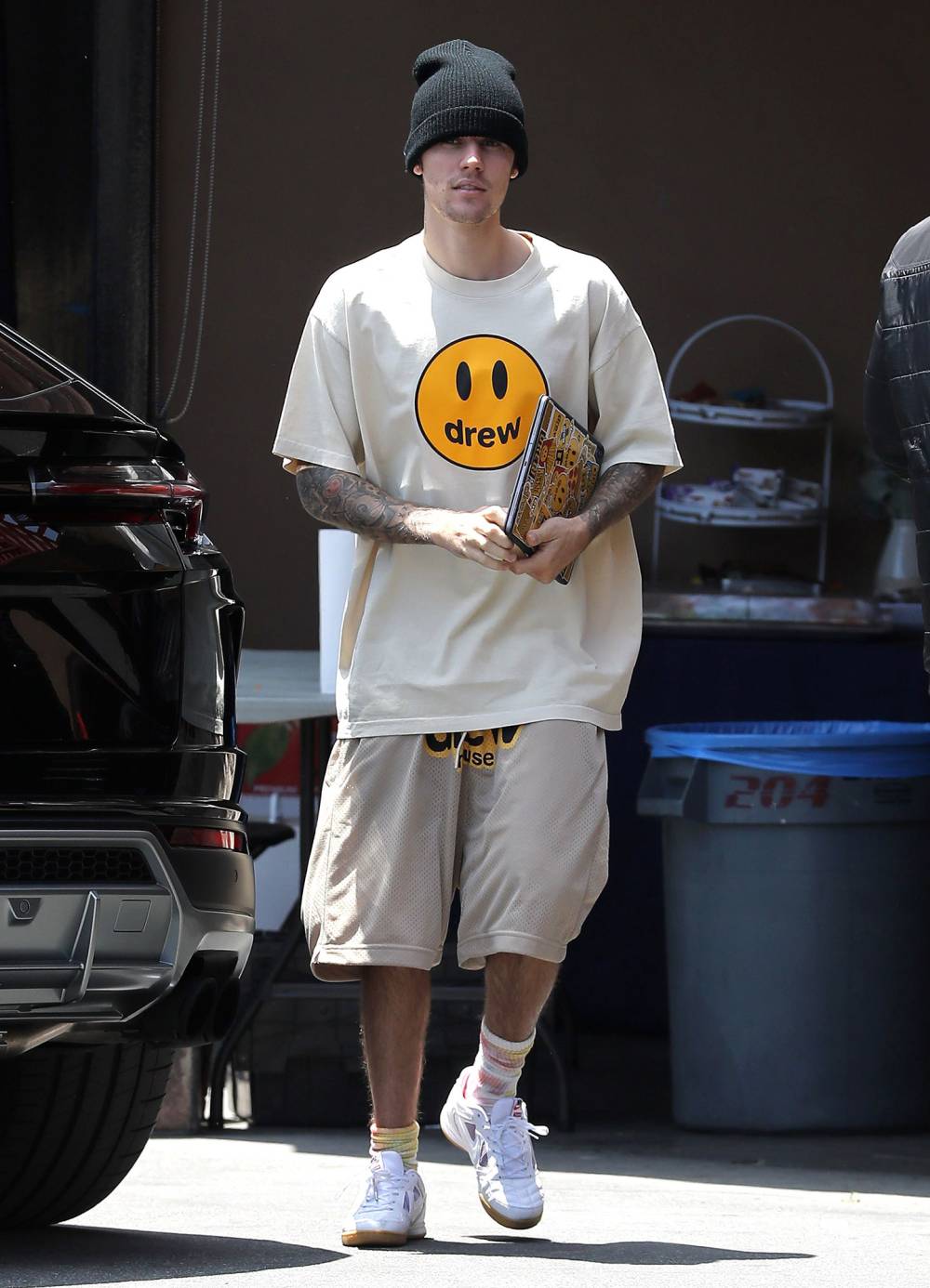Justin Bieber Wearing Knit Hat and Smile Face Drew Shirt and Shorts