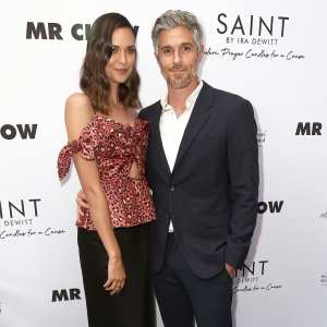 Odette Annable Wearing a Black Skirt and Multi Color Topa nd Dave Annable With White Shirt and Suit