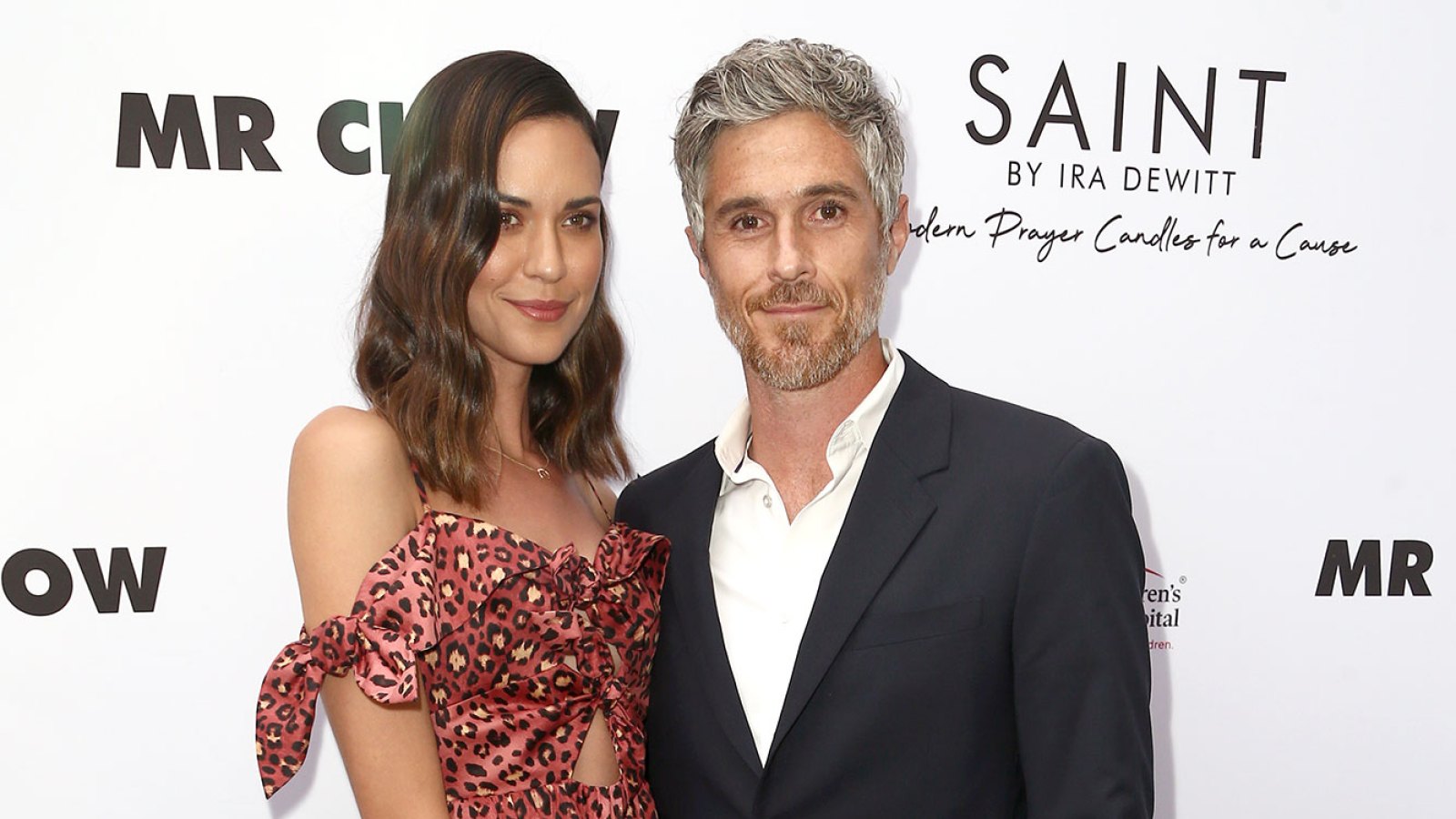 Odette Annable Wearing a Black Skirt and Multi Color Topa nd Dave Annable With White Shirt and Suit
