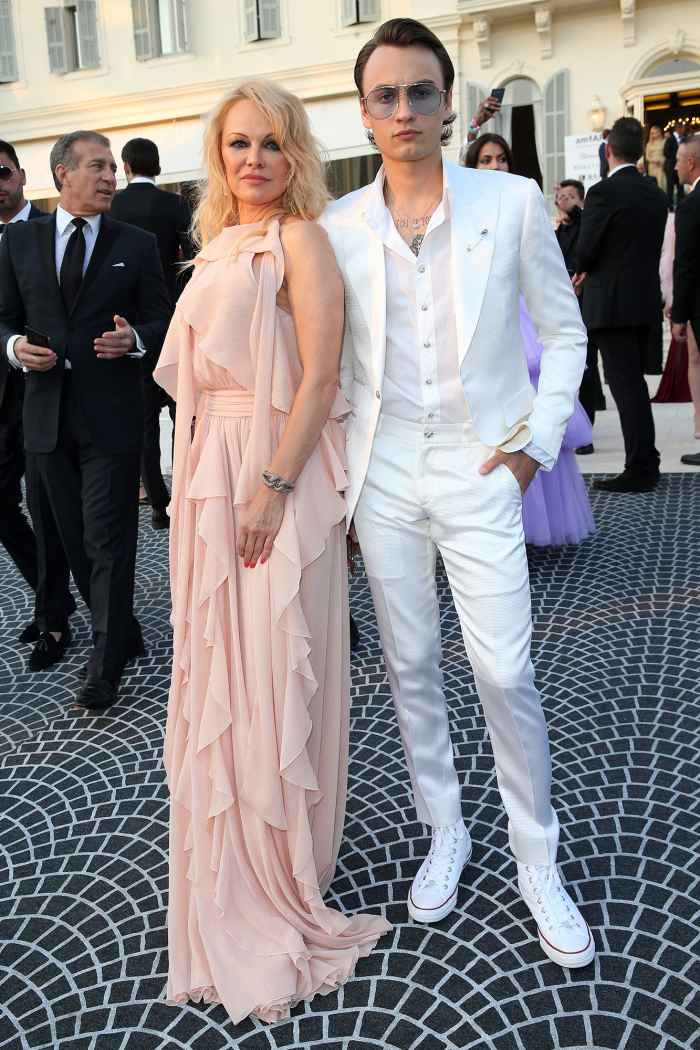 Pamela Anderson and Brandon Lee Dressed in All White Suit