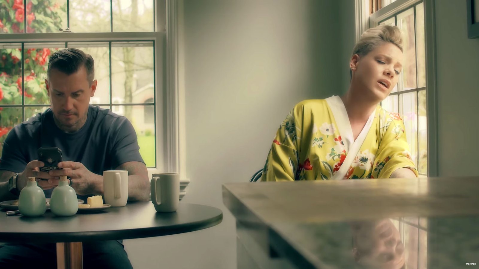 Pink and Carey Hart New Music Video Yellow Bath Robe With Flowers On Phone Drinking Coffee