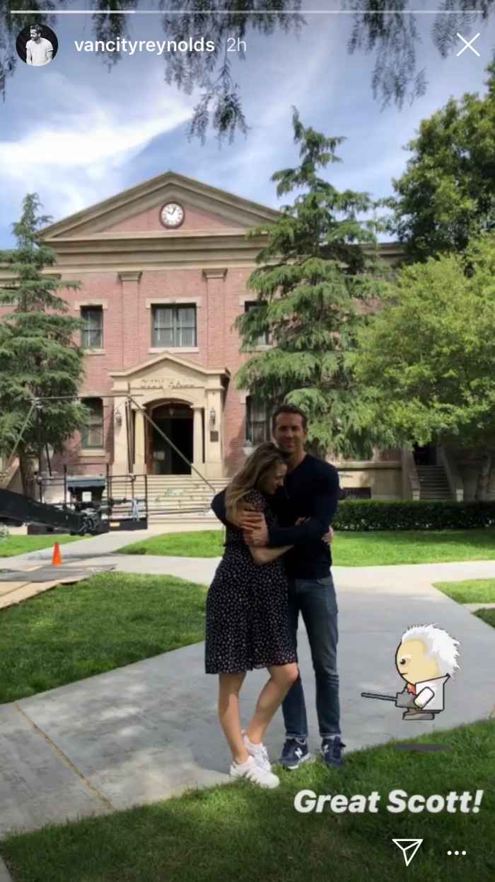 Ryan Reynolds and Blake Lively stand in front of the clock tower from Back To The Future