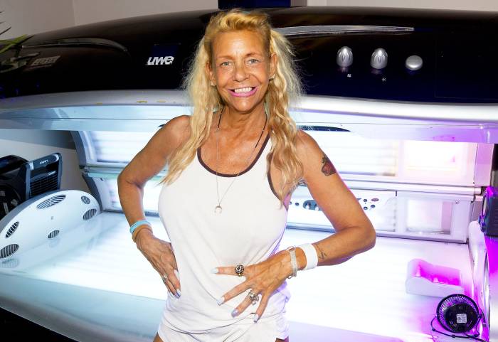 Tan Mom Patricia Krentcil Poses In Front of a Tanning Bed Ready to Take the Music Business By Storm