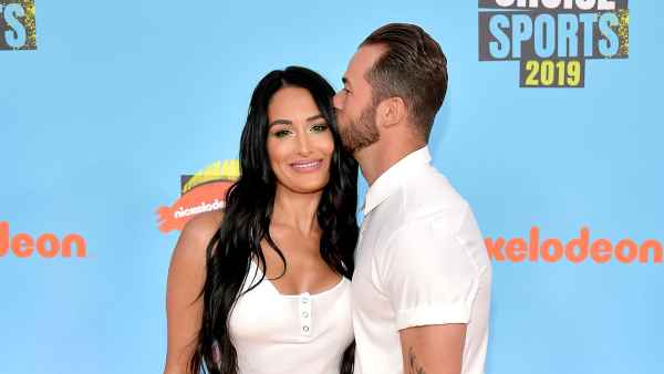 Nikki Bella and Artem Chigvintsev Red Orange Carpet Nickelodeon Kids' Choice Sports 2019