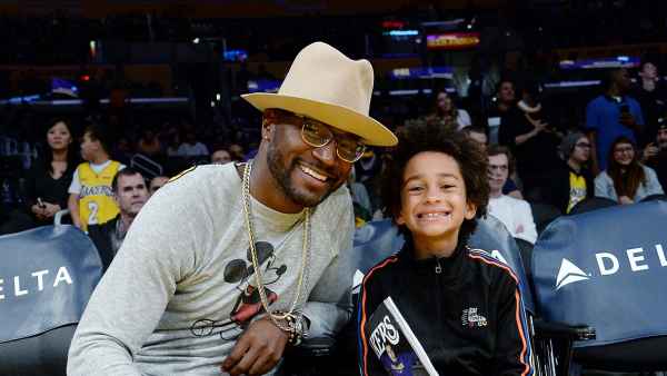 Taye Diggs and His Son Walker Diggs Watch Basketball Game Lakers vs Pacers Large Brim Hat and Glasses