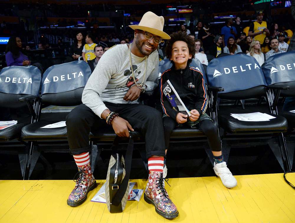 Taye Diggs and His Son Walker Diggs Watch Basketball Game Lakers vs Pacers Large Brim Hat and Glasses