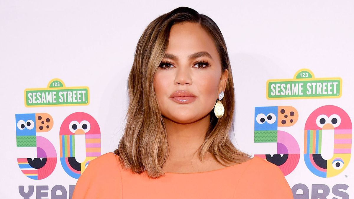 Chrissy Teigen Orange Dress May 29, 2019