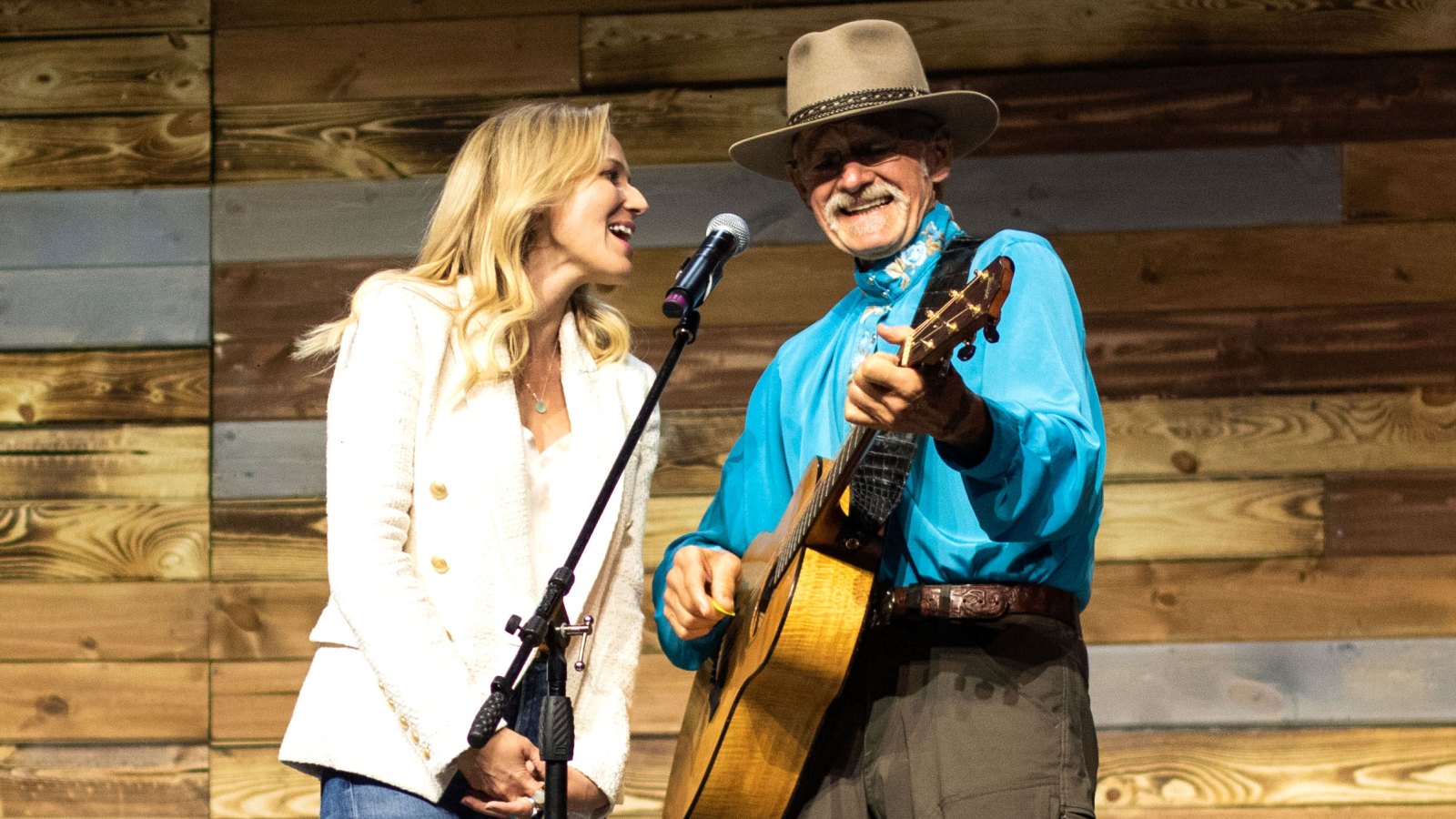 Inside the Denver Wellness Your Way Festival Jewel and her father, Atz Kilcher, performing together on the Johnson & Johnson main stage