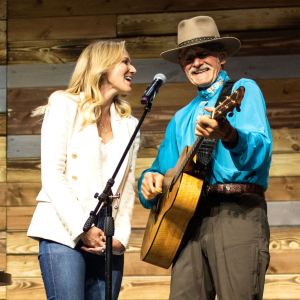 Inside the Denver Wellness Your Way Festival Jewel and her father, Atz Kilcher, performing together on the Johnson & Johnson main stage