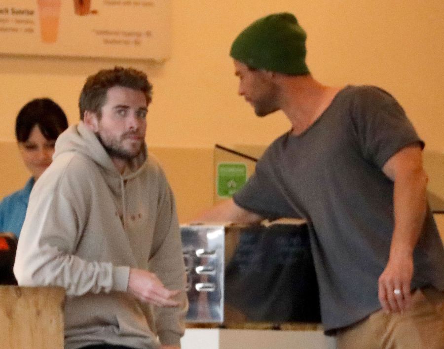 Liam Hemsworth With Chris Hemsworth Wearing A Grean Ski Hat Breaks Silence After Miley Cyrus