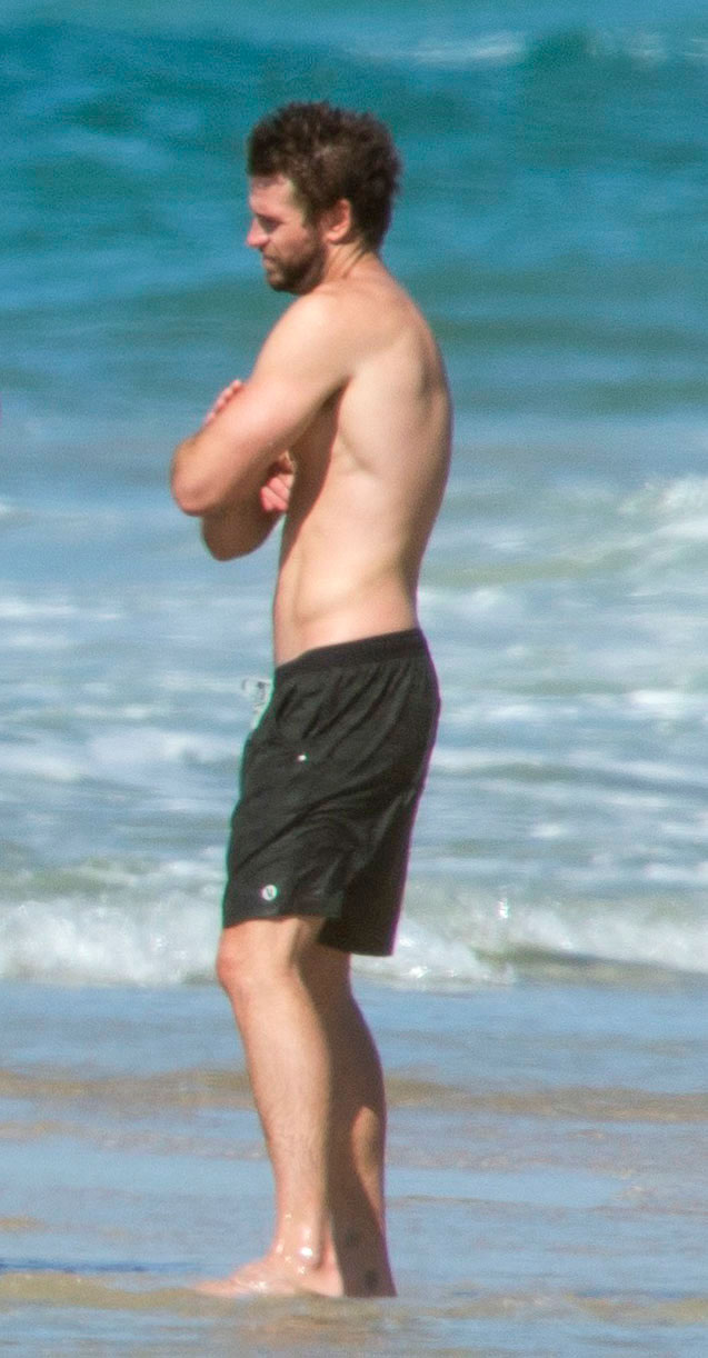 Liam Hemsworth Looks Gloomy at Beach With Chris Hemsworth After Miley Cyrus Split