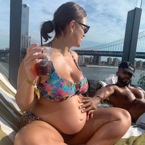 Ashley Graham Embraces Her Bare Baby Bump During 'Staycation' With Husband Justin Ervin