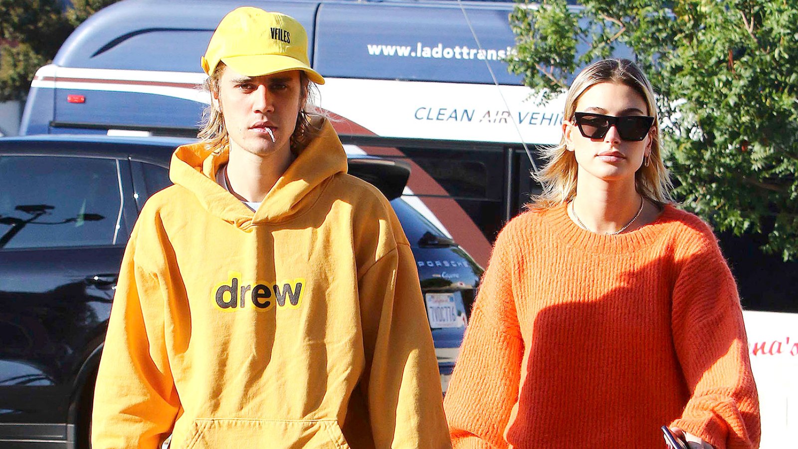 Justin Bieber and Hailey Baldwin Thanks Parents Yellow Hoodie Drew Orange Sweater