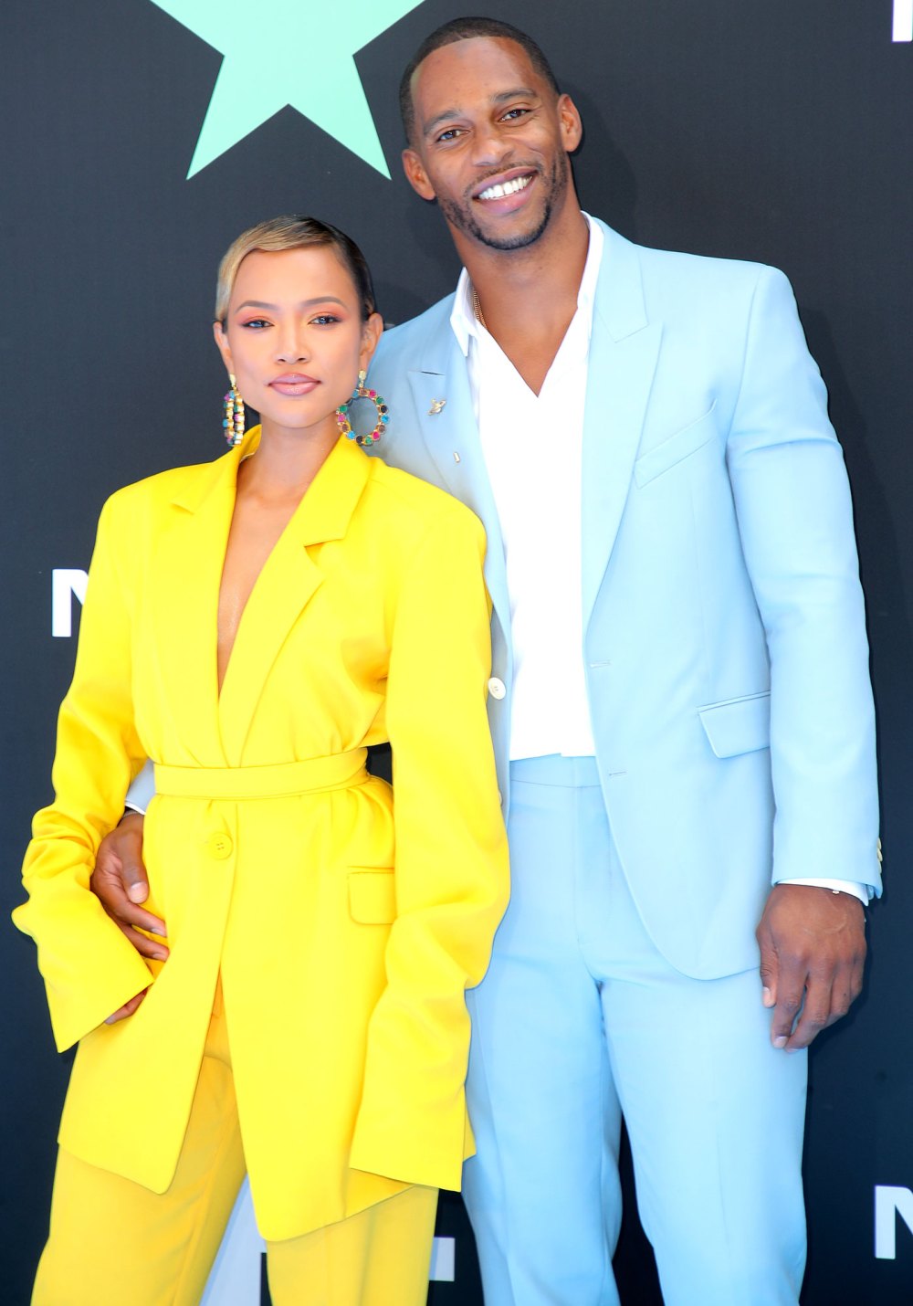 Karrueche-Tran-Yellow-Outfit-and-Victor-Cruz-Baby-Blue-Jacket-and-Pants-BET-Awards