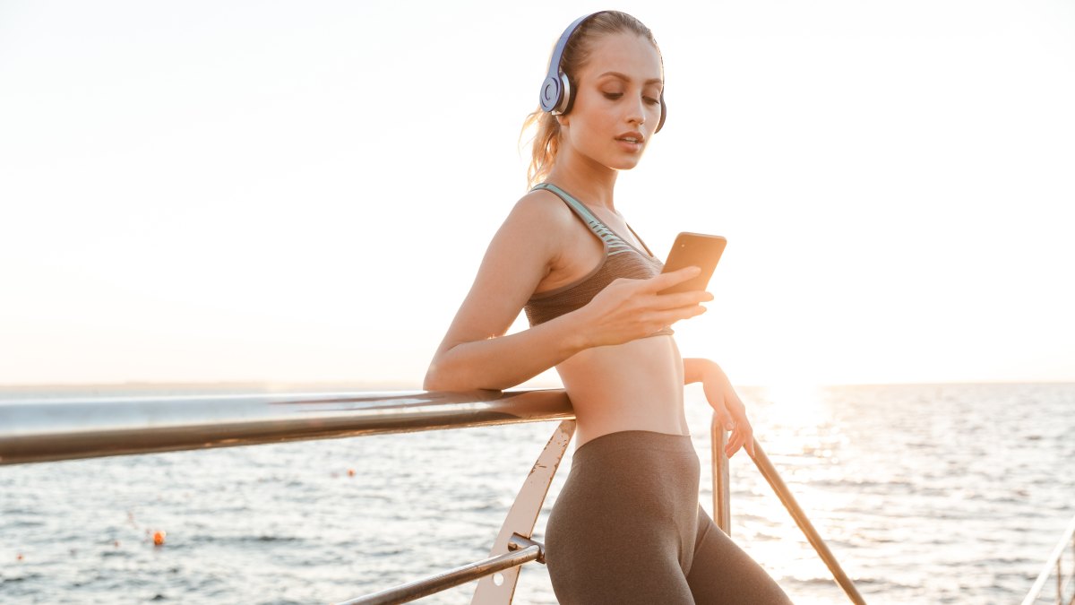 woman working out using phone noom