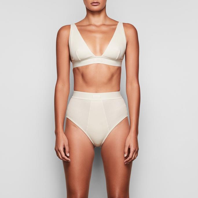 Skims Cotton Balconette Bra in Bone, Kim Kardashian Launches Cotton Skims  Collection, and TBH, It Looks a Lot Like Her Everyday Clothes