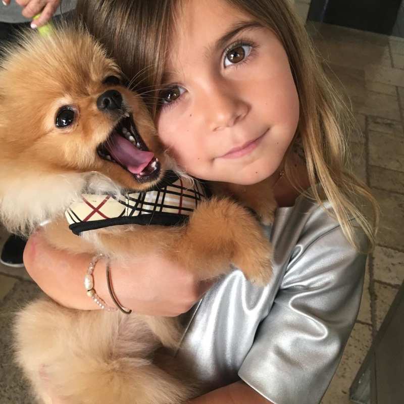 Penelope Disick Hugs Puppy