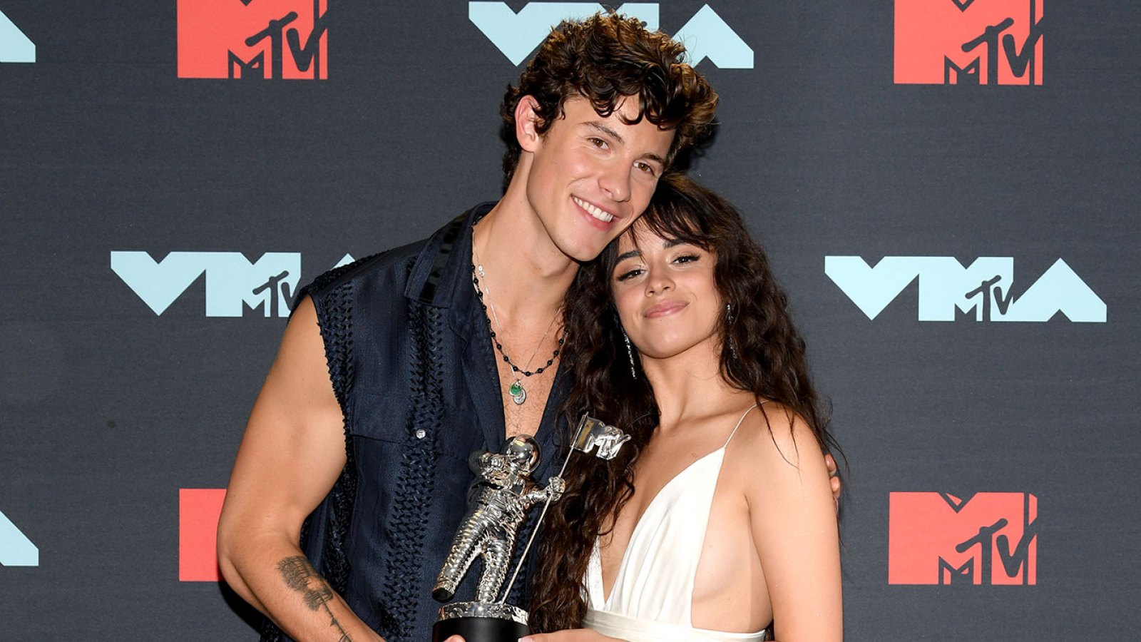 Shawn Mendes and Camila Cabello Holding MTV Award