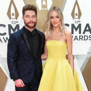Chris Lane and Lauren Lane 2019 CMA Awards Arrival Red Carpet Yellow Dress
