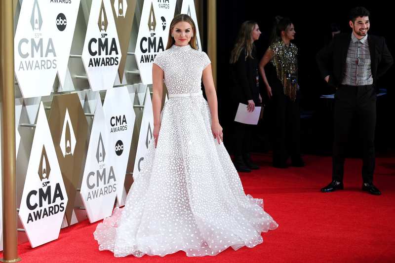 Hannah Brown and Alan Bersten 2019 CMA Awards Arrival Red Carpet White Dress