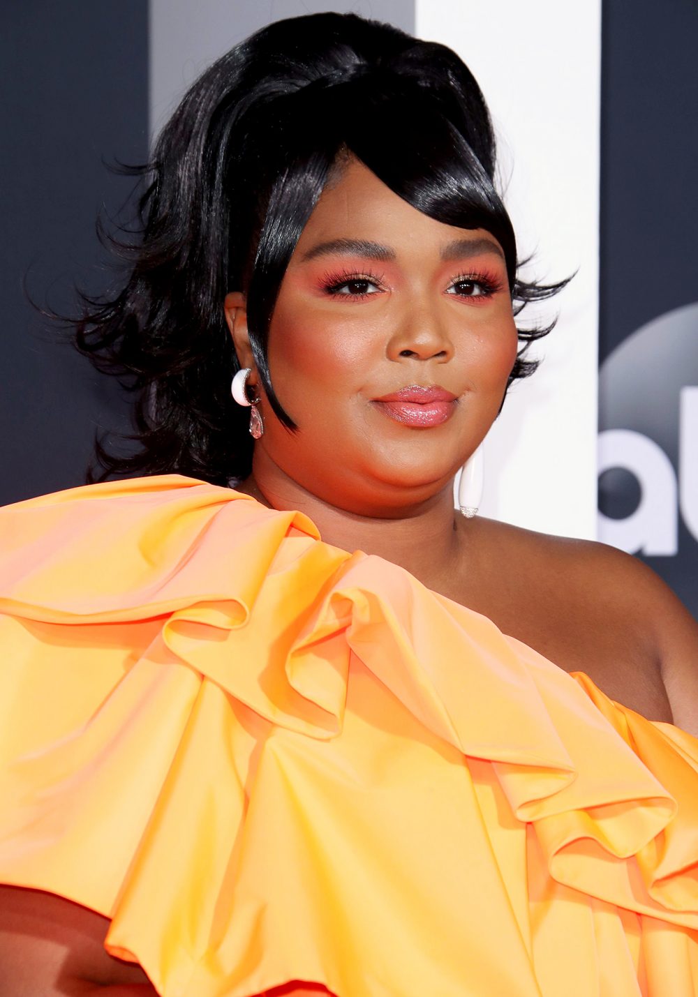 Lizzo Carries Tiny Valentino Purse at AMAs 2019
