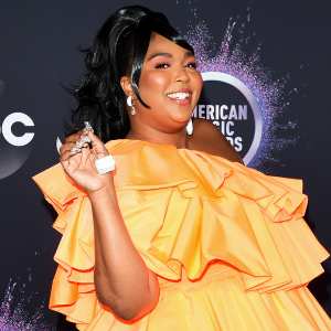 Lizzo Carries Tiny Valentino Purse at AMAs 2019
