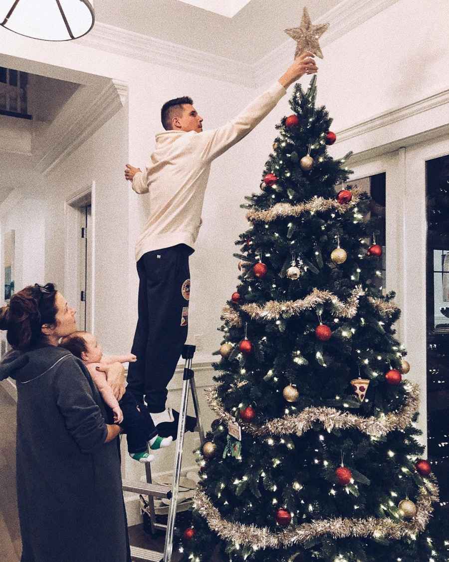 Celebrities Picking and Decorating Christmas Trees With Their Kids Robbie Amell and Italia Ricci