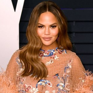 Chrissy Teigen Claps Back at Troll Who Tells Her to 'Cover Up' Around Her Daughter