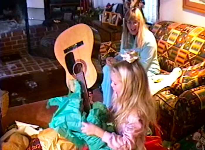 Taylor Swift Receives a Guitar as a Gift in Video for Christmas Tree Farm