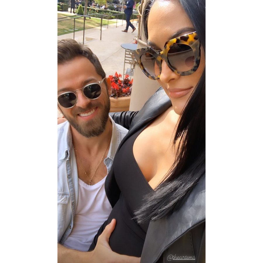 Artem-Chignitsev-Cradles-Pregnant-Nikki-Bella’s-Baby-Bump