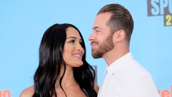 Artem-Chignitsev-Cradles-Pregnant-Nikki-Bella’s-Baby-Bump