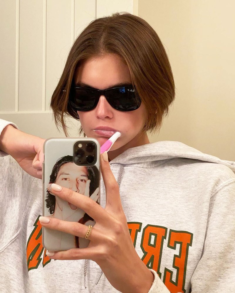 Kaia Gerber Brushing Her Teeth with a Phone Case with Adam Driver on it How the Stars Celebrated New Years Eve 2020