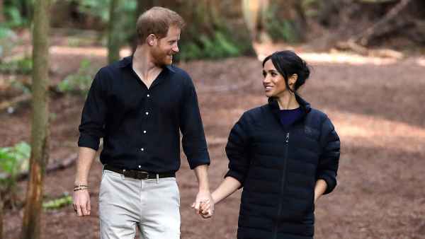 Prince Harry and Meghan Duchess of Sussex Walk Through a Redwoods Forest