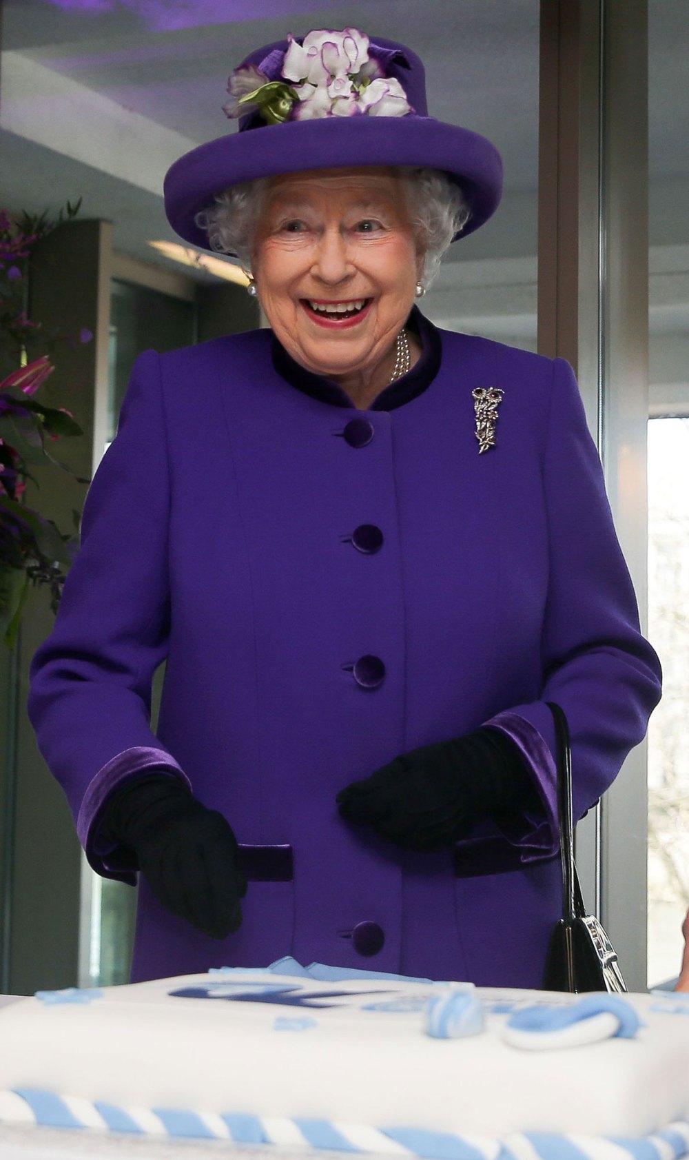 Queen Elizabeth II Cutting Cake Purple Jacket Purle Hat