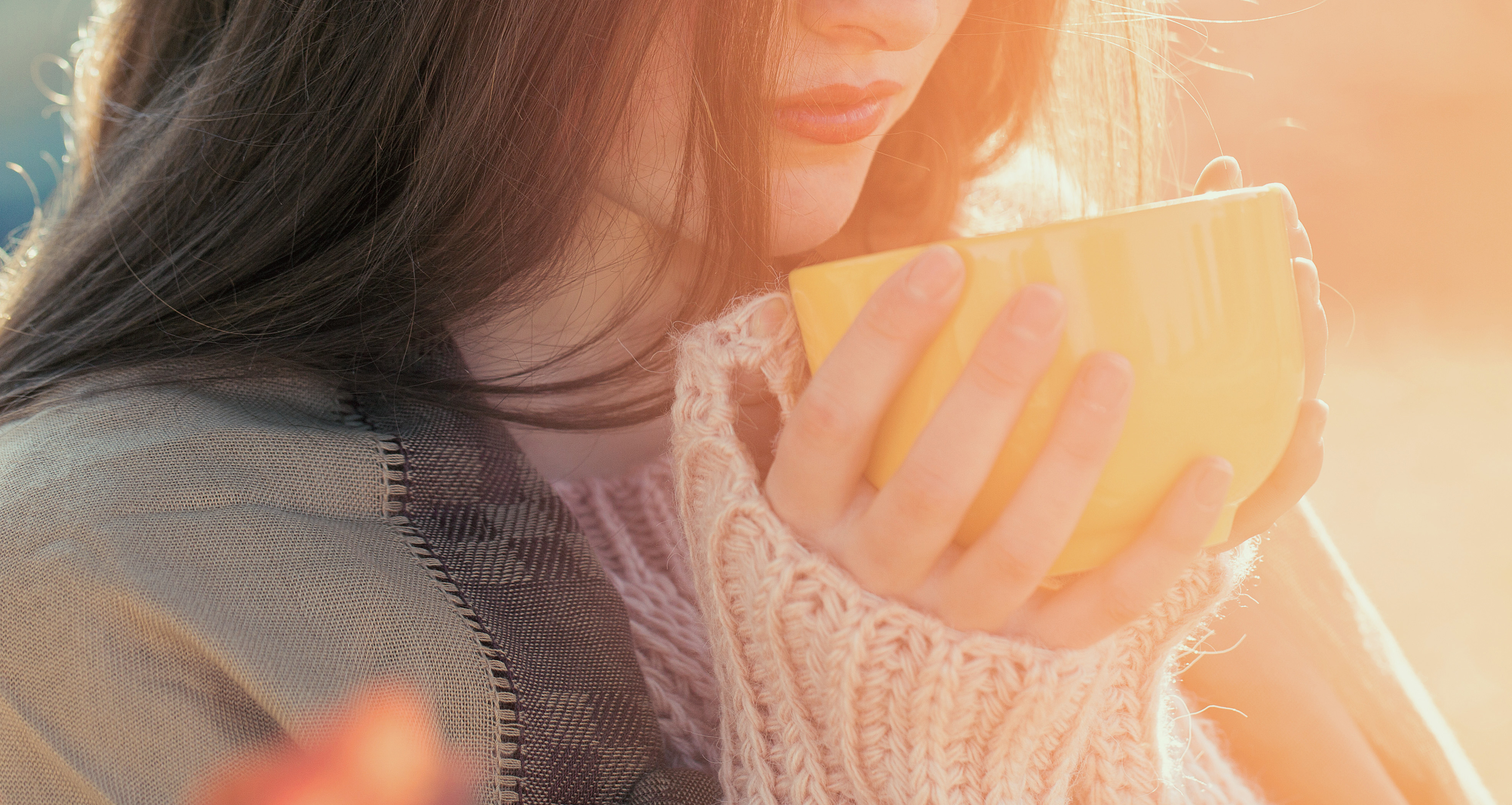 woman drinking hot cup of tea