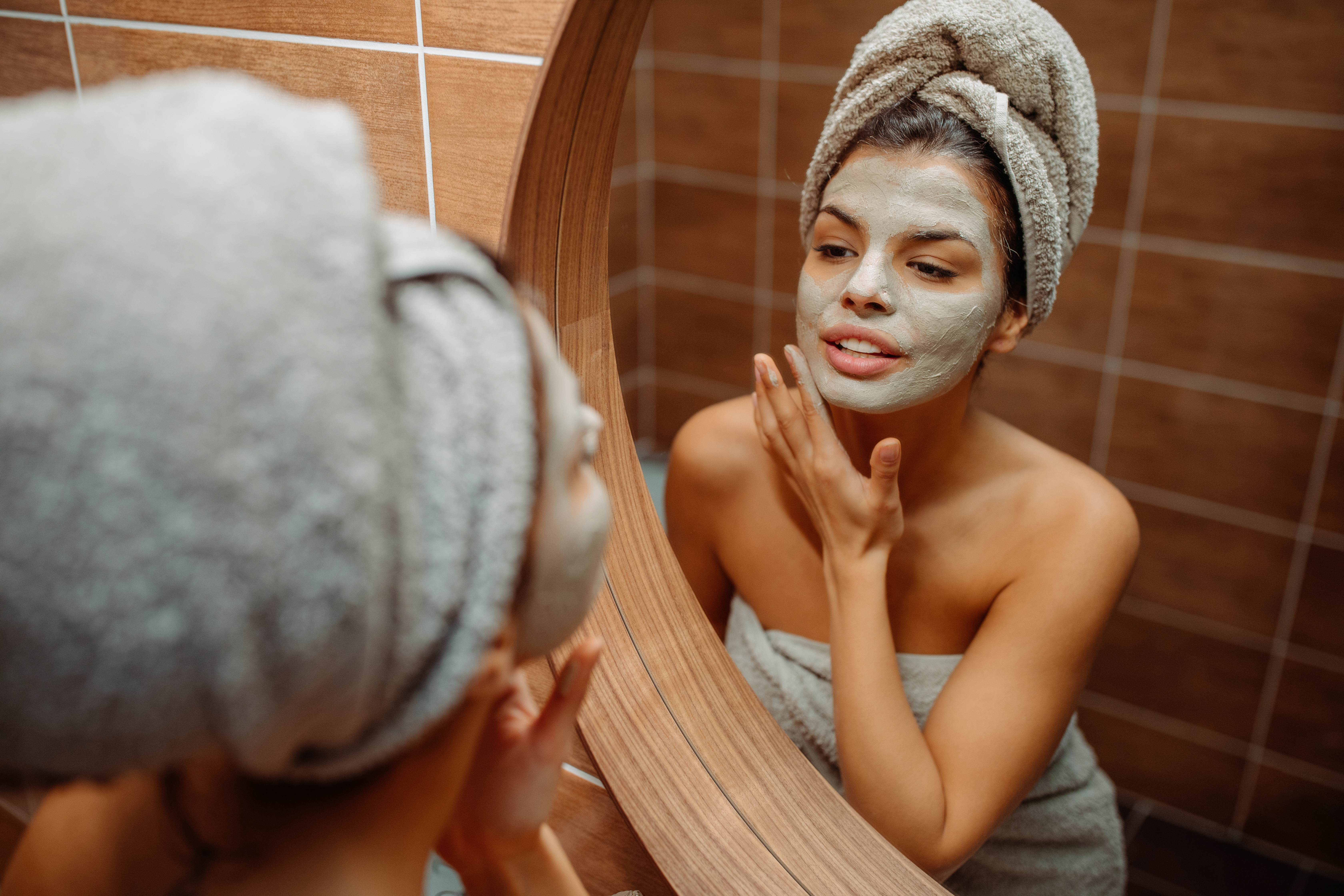 woman using face mask at home