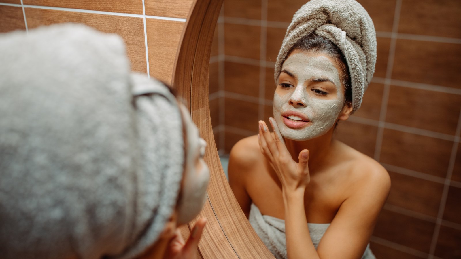 woman using face mask at home