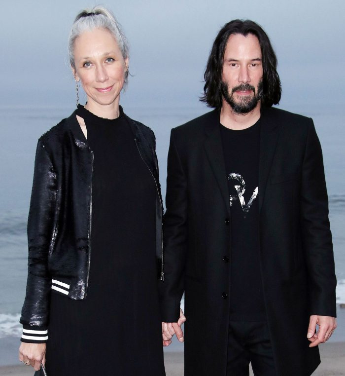 Alexandra Grant and Keanu Reeves attend the Saint Laurent Show Jennifer Tilly Confirms Keanu Reeves and Alexandra Grant Have Been Dating for Several Years