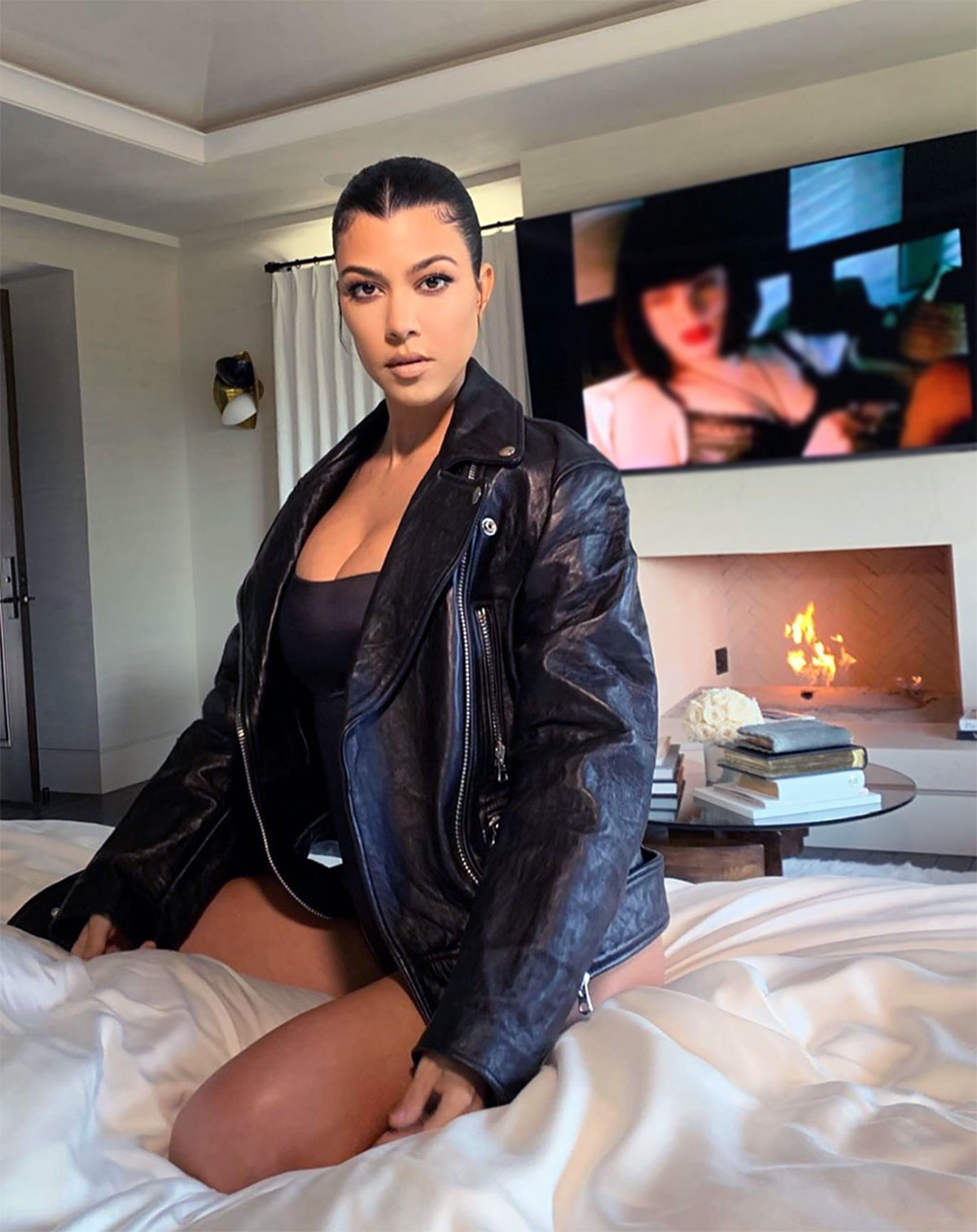 Kim Kardashian's Skims faux leather bodysuit and shorts