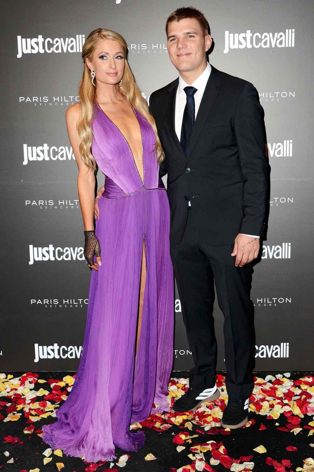 Paris Hilton and Chris Zylka Just Cavalli Paris Hilton Skincare Event Purple Dress