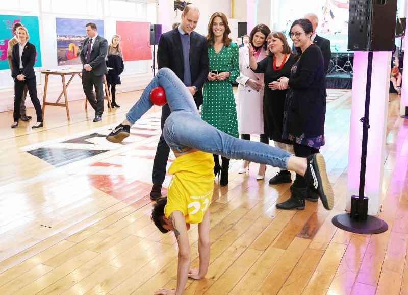 Prince William and Duchess Kate Visit Ireland watch a performance during a meeting with Galway Community Circus performers