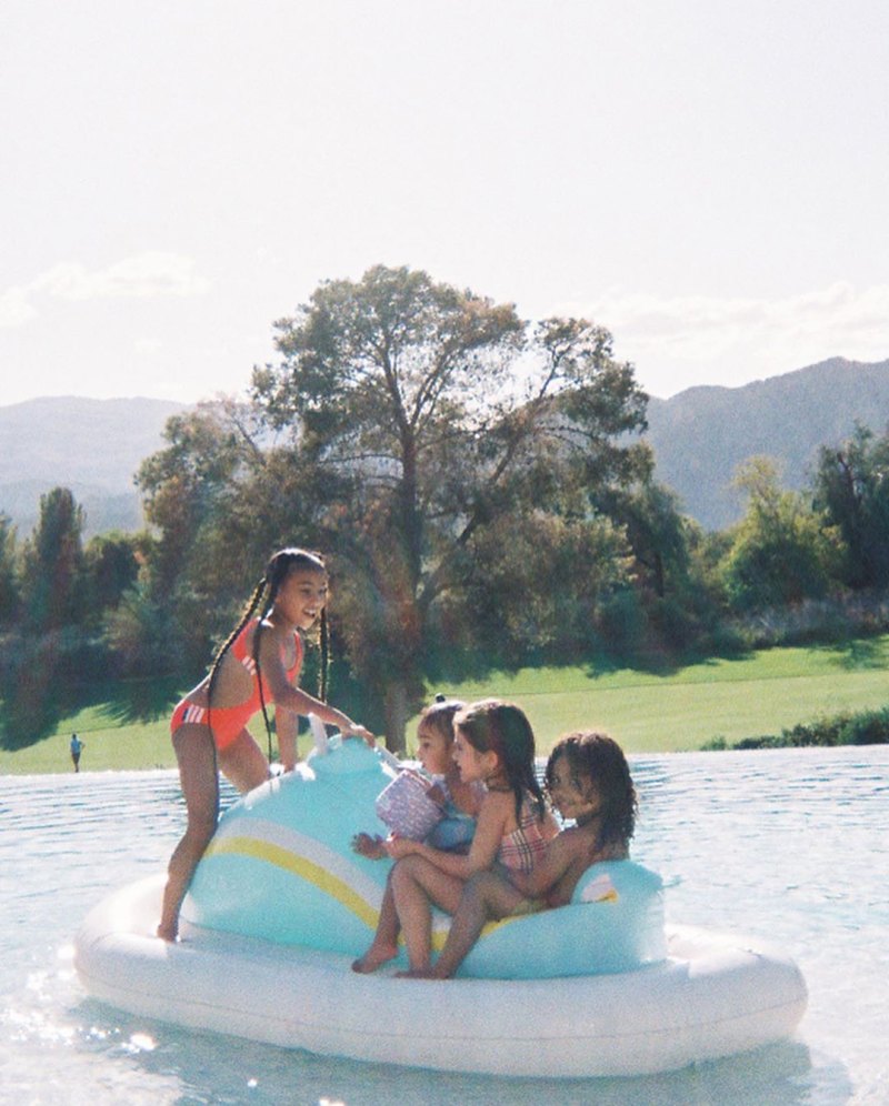 North West Chicago West Penelope Disick and Saint West on a Pool Float