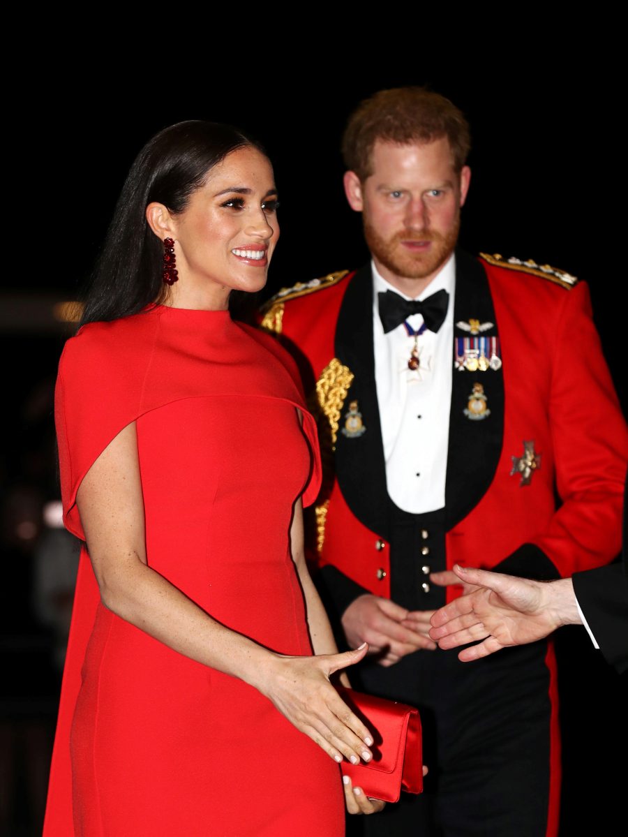 Prince Harry and Duchess Meghan Hold Hands in Matching Red at Festival of Music