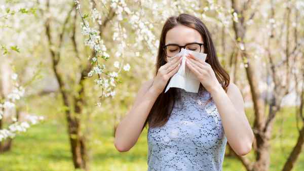person with allergies outside