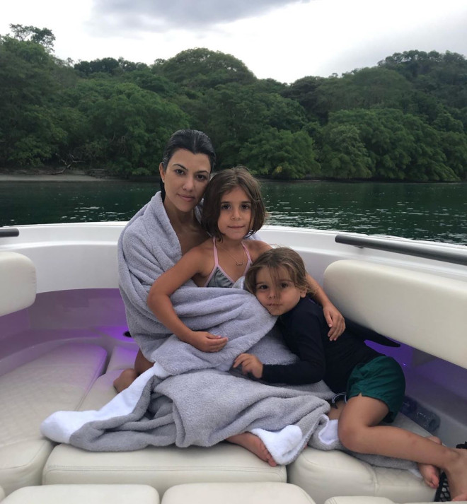 Time to Travel Kourtney Kardashian Claps Back at Parenting Police Over Son Hair Kids Vacations More
