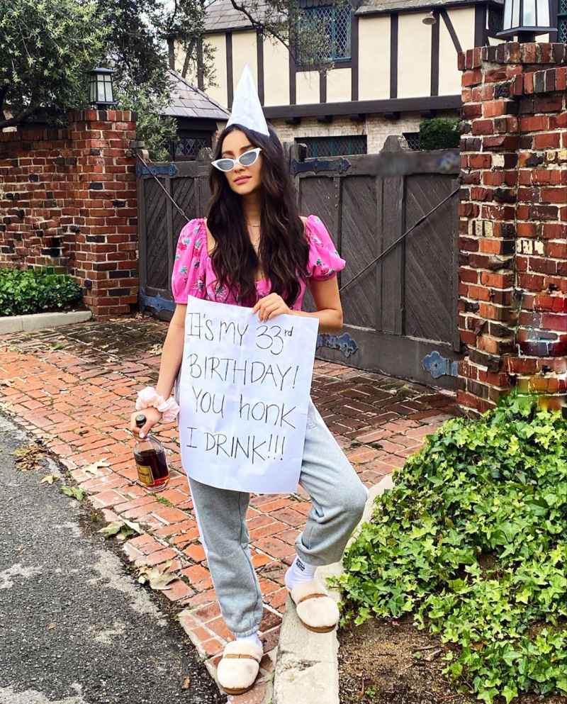 Shay Mitchell also shared a video of herself waking up and drinking curbside, while holding her b-day sign that read “It’s my 33rd birthday! You honk I drink