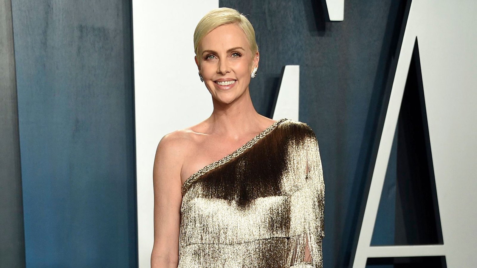 Charlize Theron Posts Rare Pic of Daughter Jackson on Mad Max Oscar Gold Dress